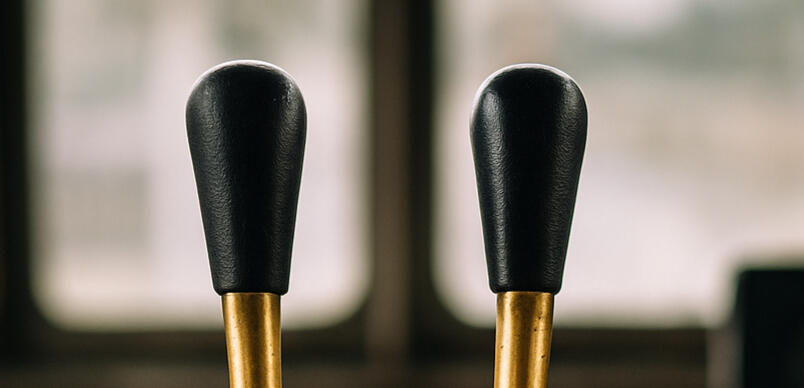 Twin brass control levers